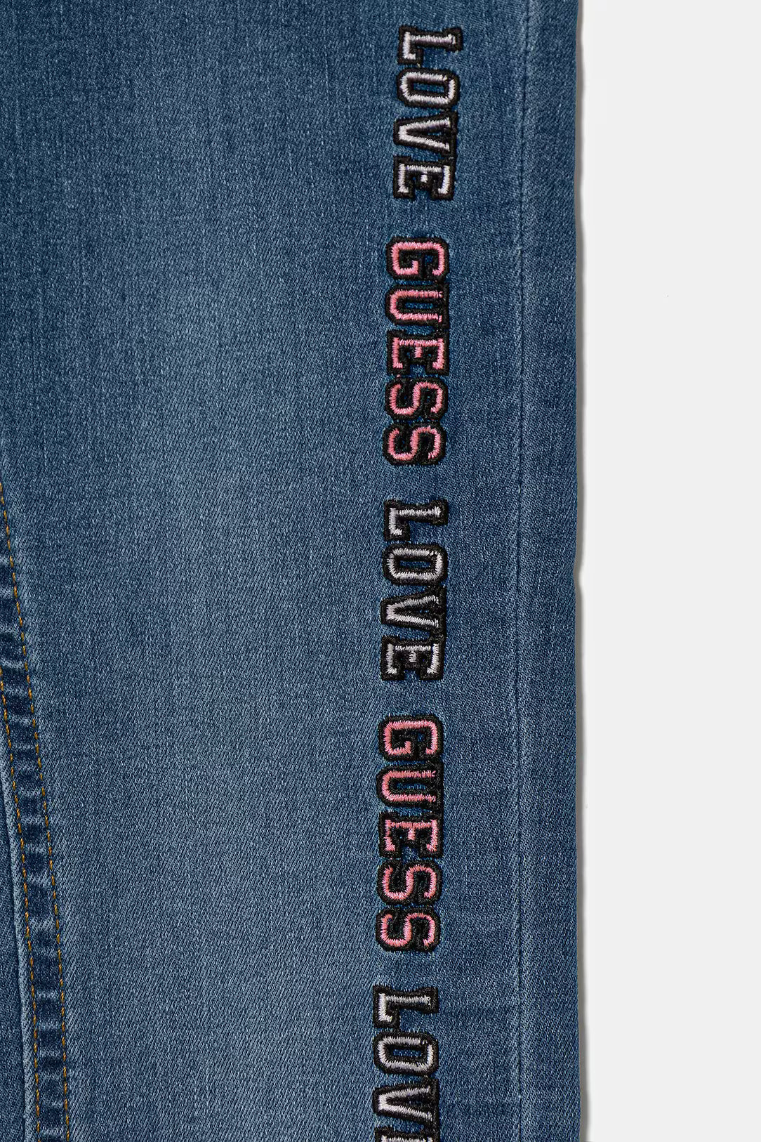 Jeans Guess con scritta per bambina