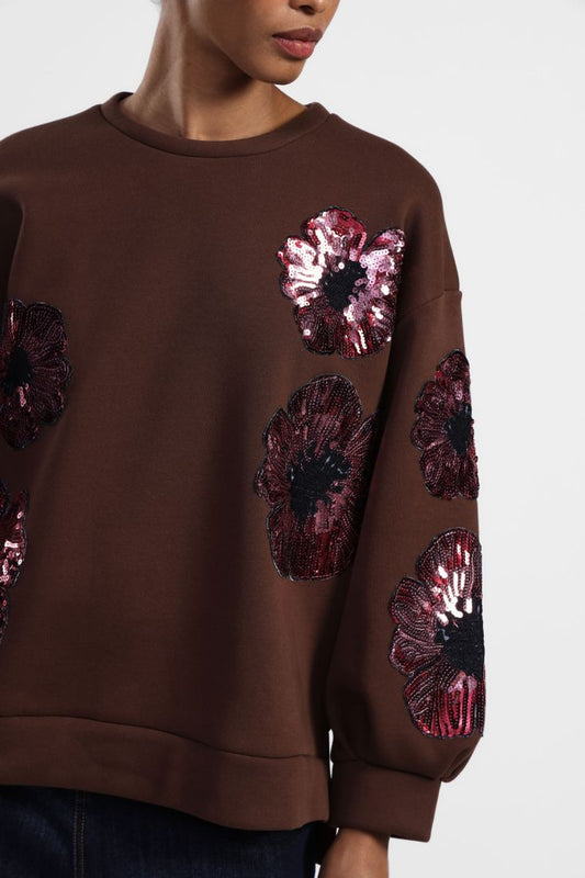 Felpa con fiori ricamati e maniche lunghe